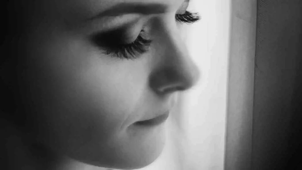a close-up photo of a bride and her eyelash extensions