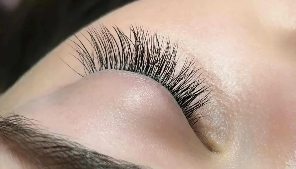 Close-up of an eye with classic eyelash extensions.